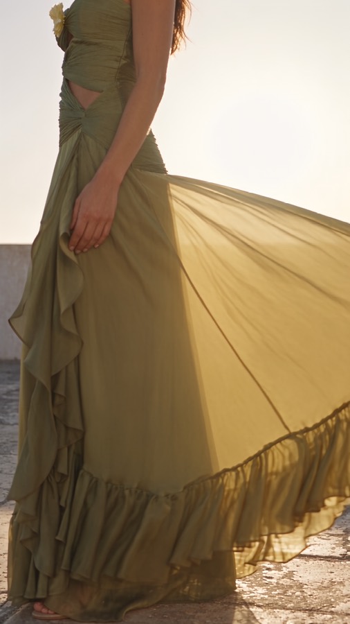 Golden Hour ad: an olive dress flowing at sunset