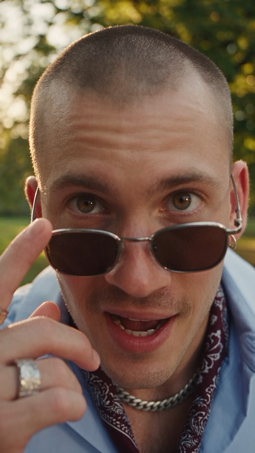 Shades Down ad: a man tipping his sunglasses down in golden light