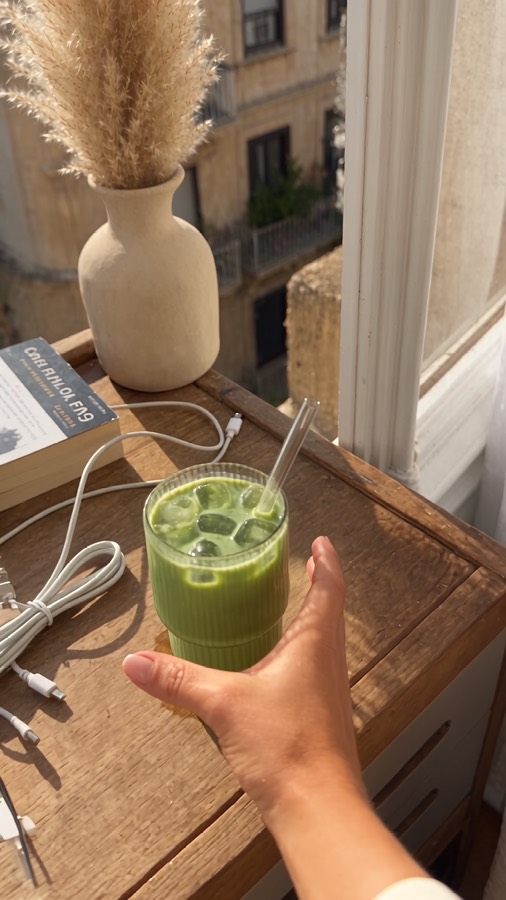Slow Matcha ad: an iced matcha by a sunny window